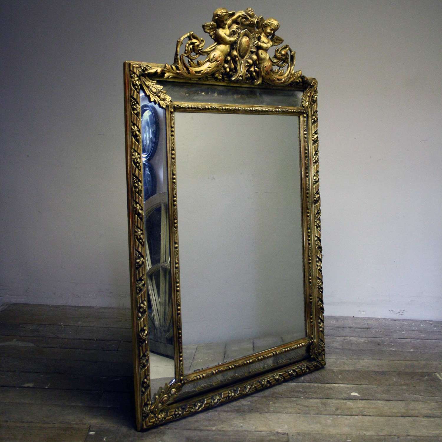 A 20th Century carved wood and gesso Cushion mirror