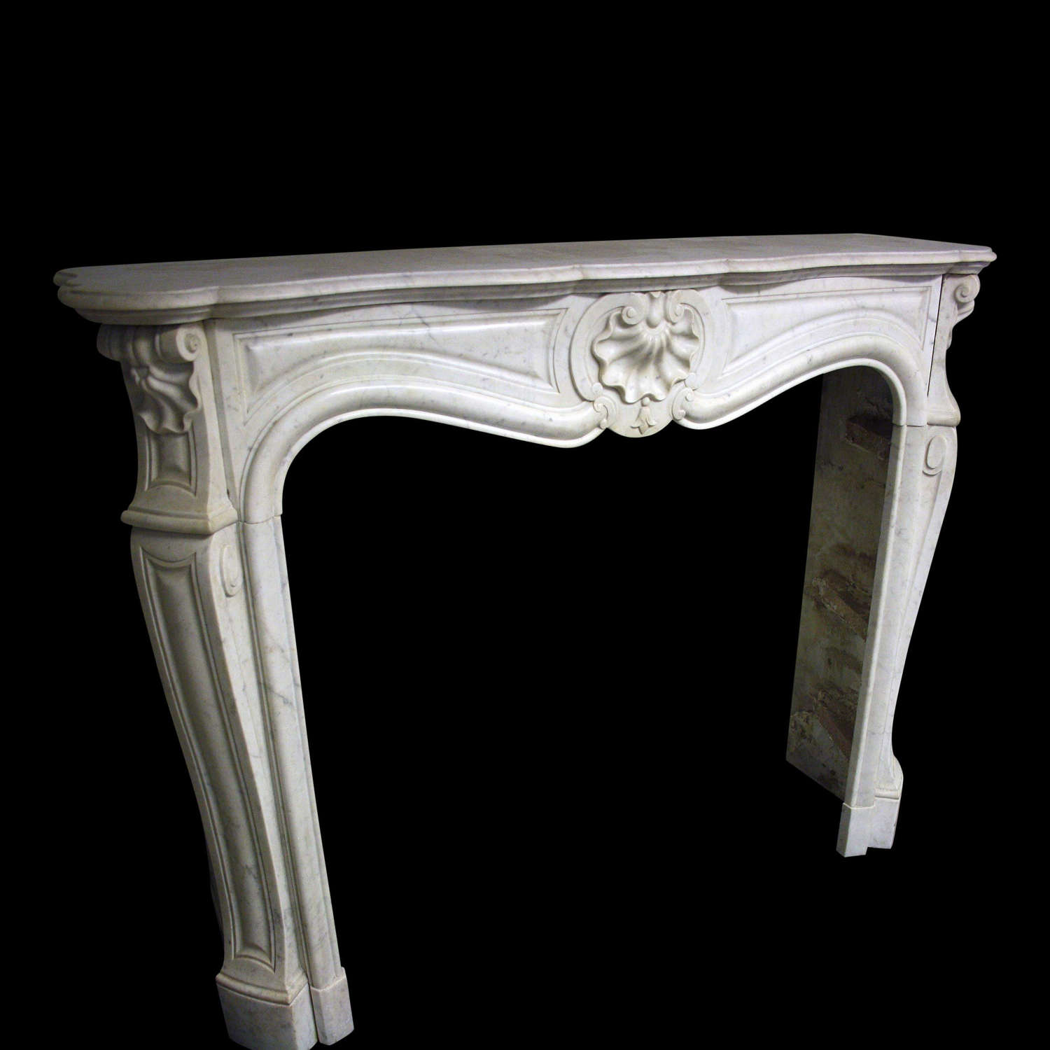 A 19th Century French Chimneypiece in marble in the Louis XV manner.