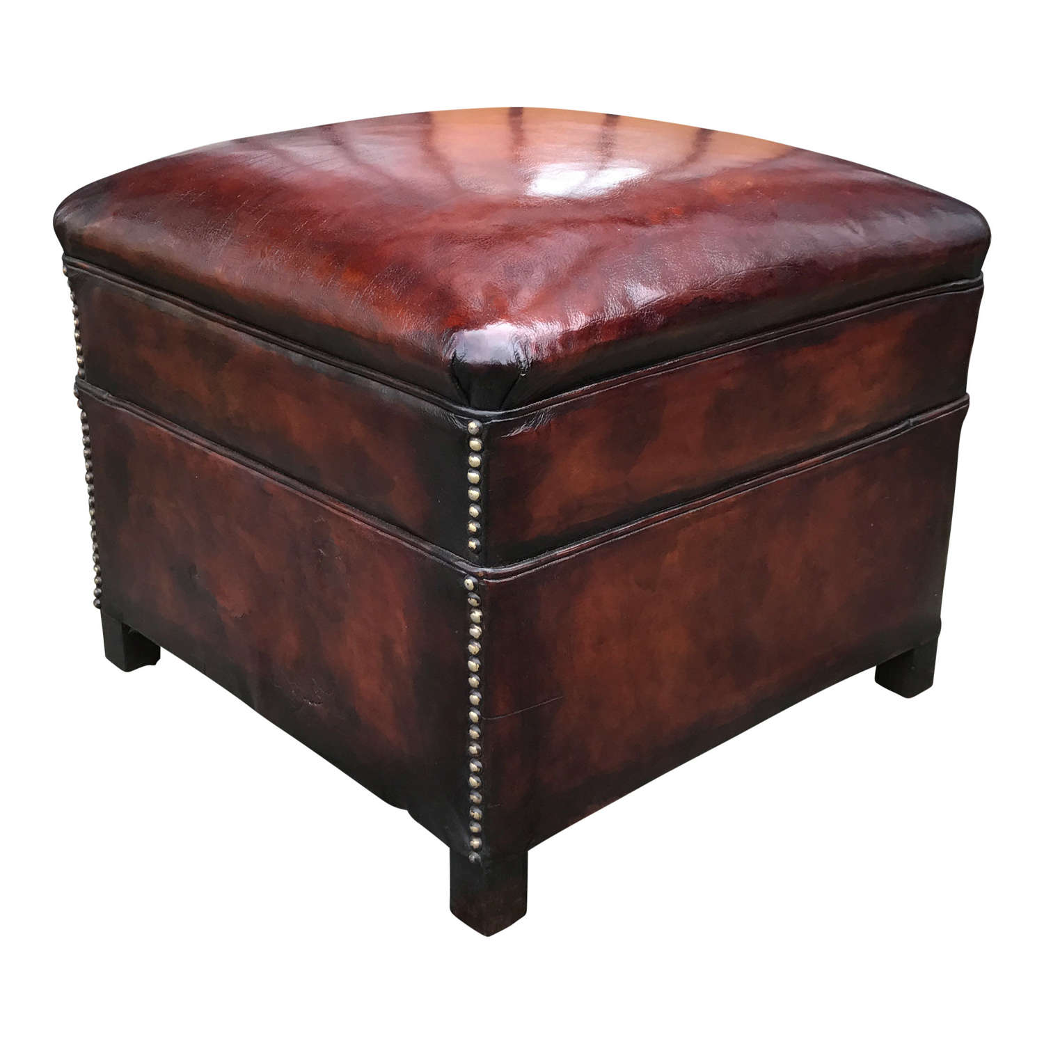 A stunning mid 20th Century studded conker brown leather footstool