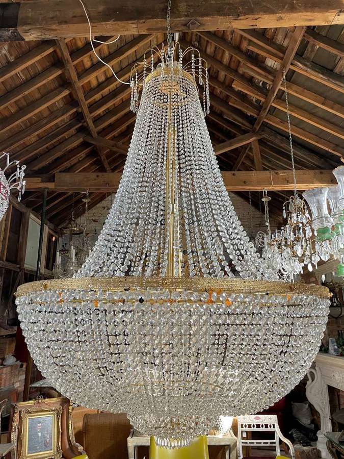 Monumental 20th century classic cascade chandelier with gold metal ban