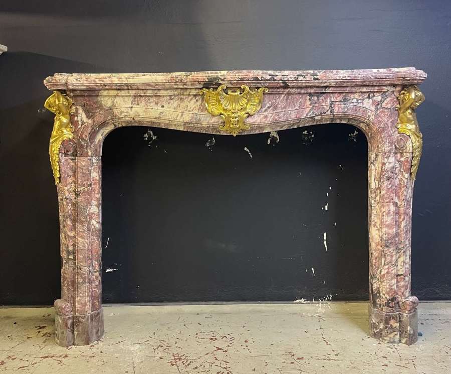 A Grand French Chateau Chimneypiece in Fleur de Peche Marble.